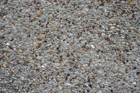Texture concrete wall with pebbles Stock Photos