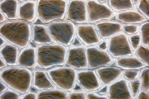 The texture of the concrete wall under the stylization of snake skin extruded Foto stock