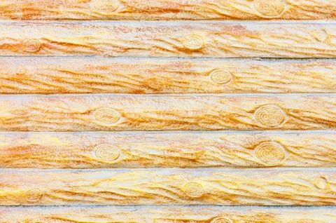 The texture of the concrete wall under the stylization of a wooden fence with Fotos de archivo