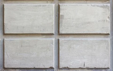 The texture of the concrete walls with rectangular shapes. Closeup Stock Photos