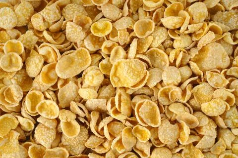 Texture of corn flakes in sugar glazed. Dry breakfast Stock Photos