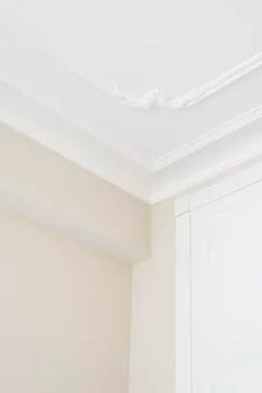 The texture of the corner of the ceiling and white wall with a pattern Stock Photos