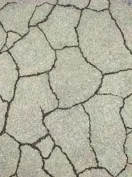 Texture of cracked asphalt close up Stock Photos