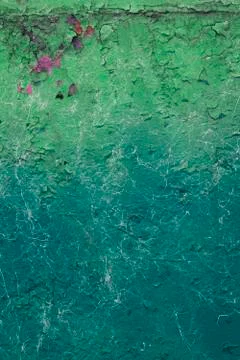 The texture of cracked green paint in different shades with spots and stains Stock Photos