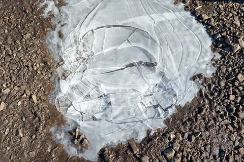 The texture of cracked ice on the ground Stock Photos