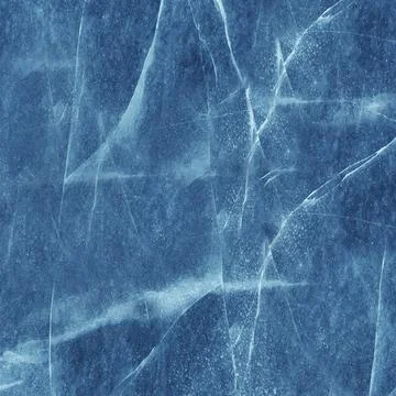 The texture of the cracked ice surface is blue Stock Photos
