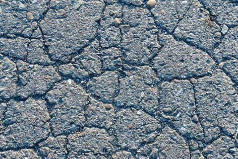 Texture of cracked old road surface, background of old asphalt road or sidewalk Stock Photos