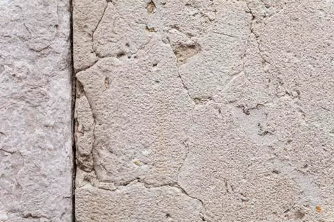 Texture Of Cracks In An Ancient Stone Wall. Stock Photos