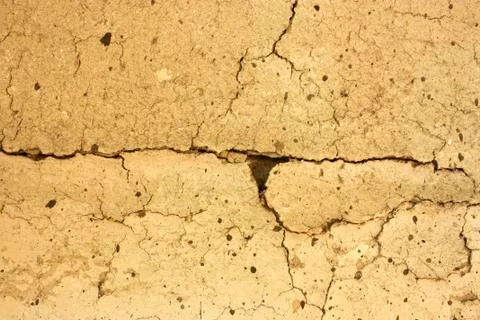 Texture of cracks, old clay wall Stock Photos