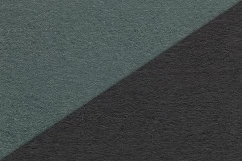 Texture of craft black and dark green paper background, half two colors, macr Stock Photos