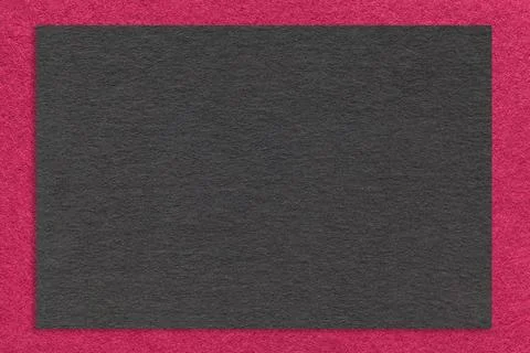 Texture craft black paper background with purple border, macro. Stock Photos
