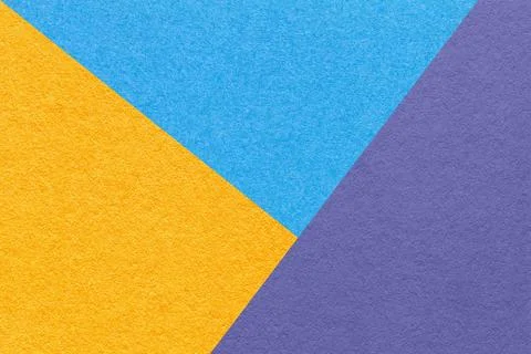 Texture of craft blue, yellow and violet shade color paper background, macro. Stock Photos