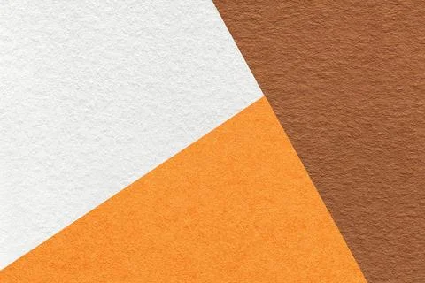 Texture of craft brown, white and orange shade color paper background, macro Stock Photos