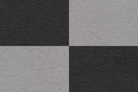 Texture of craft gray and black paper background with cells pattern, macro. Stock Photos