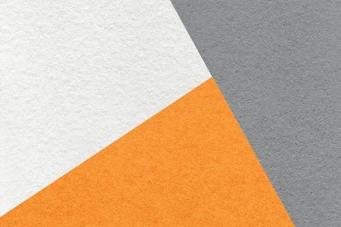 Texture of craft gray, white and orange shade color paper background, macro Stockfoto's