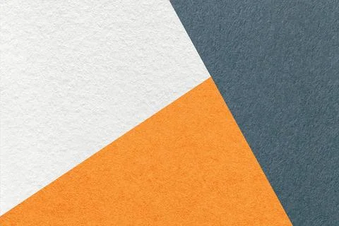 Texture of craft gray, white and orange color paper background, macro. Stockfoto's