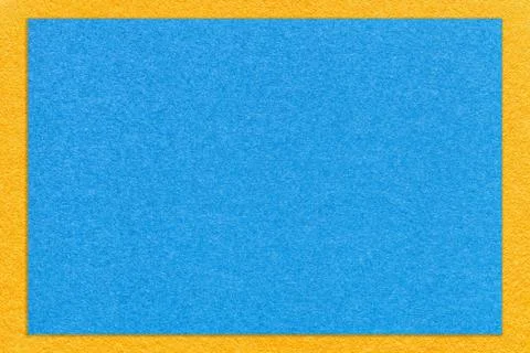 Texture of craft light blue color paper background with yellow border Stock Photos