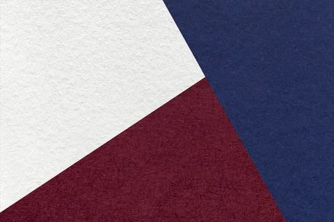 Texture of craft navy blue, white and dark wine shade color paper background. Stockfoto's