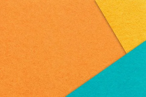 Texture craft orange paper background with yellow and turquoise border. Stock Photos