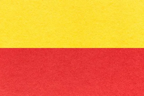 Texture of craft red and yellow paper background, half two colors, macro. Foto stock