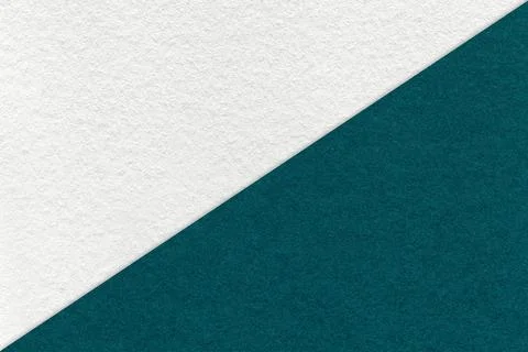Texture of craft white and emerald paper background, half two colors, macro. Stockfoto's
