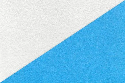 Texture of craft white and light blue paper background, half two colors, macr Stockfoto's