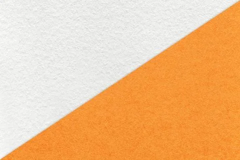 Texture of craft white and orange paper background, half two colors, macro. Stock Photos
