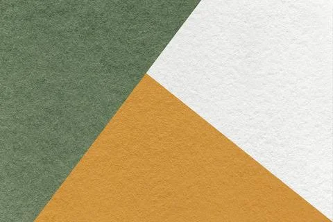 Texture of craft white, olive and orange shade color paper background, macro. Stockfoto's