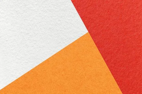 Texture of craft white, orange and red shade color paper background, macro. Stockfoto's