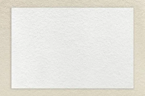 Texture of craft white paper background with light beige border, macro. Stock Photos