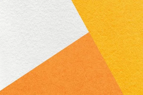 Texture of craft yellow, white and orange shade color paper background, macro Stock Photos