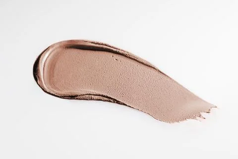 The texture of cream blush on a white background. Stock Photos