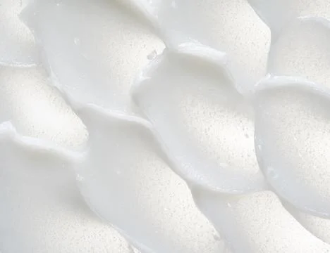 Texture of cream on white background Stock Photos