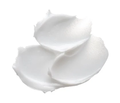 Texture of cream on white background Stock Photos
