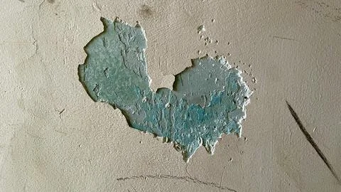 Texture of crumbled plaster on the wall and an interesting green pattern Stock Photos