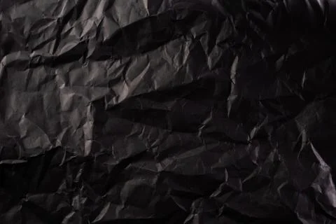 Texture of crumpled black paper. Creative vintage for design background. Stock Photos