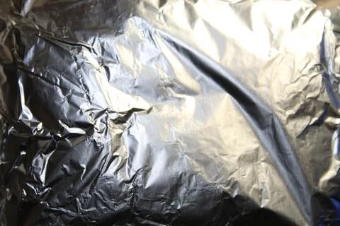 Texture of crumpled foil. Thermo packaging of food. High quality stock phot.. Stock Photos