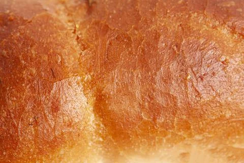 The texture of the crust of bread. Tasty fresh bread, close up. Stock Photos