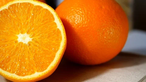 Texture of a cut mandarin orange, Camera move or dolly shot of orange slice Stock Footage 113586489