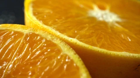 Texture of a cut mandarin orange close-up. Rotation of fresh orange fruit. 4K Stock-Footage 100211918