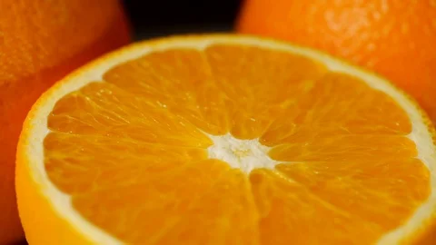 Texture of a cut mandarin orange close-up, Rotation of orange slice Stock Footage 113586562