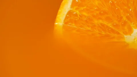 Texture of a cut mandarin orange in orange juice close-up Stock Footage 113586501