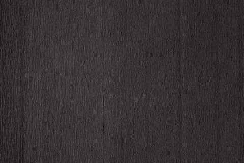 Texture of dark black corrugated thin uneven paper Stock Photos
