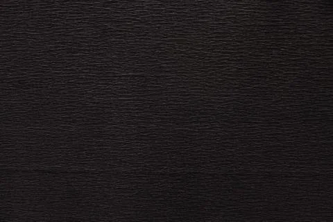 Texture of dark black corrugated thin uneven paper Stock Photos