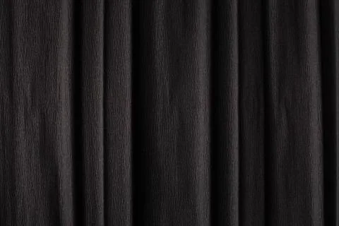 Texture of dark black corrugated thin uneven paper Stock Photos