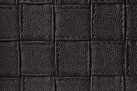 Texture of dark black leather background with square pattern and stitch, macr Stock Photos