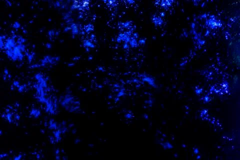 Texture with dark blue background with flour particles Stock Photos