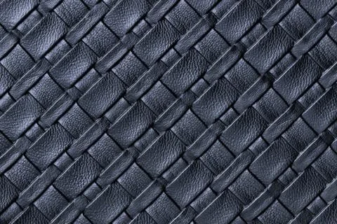 Texture of dark blue leather background with wicker pattern, macro. Stock Photos
