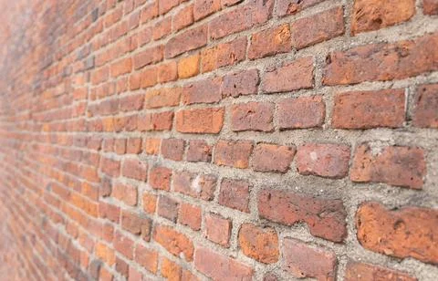 Texture dark brick wall of old castle, ancient red stone background. Stock Photos