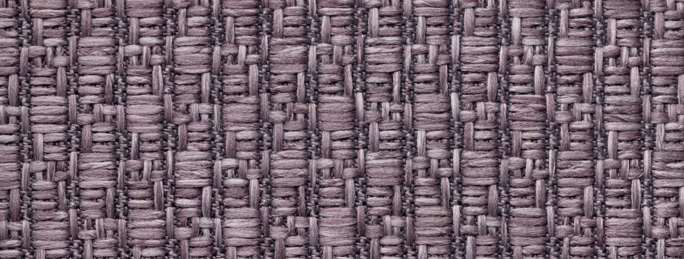 Texture dark brown background from textile with wicker pattern, macro. Stock Photos